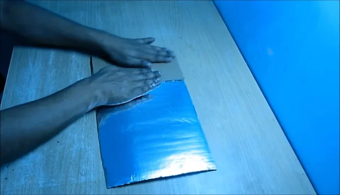 Make holes and adjust the angle: Once the glue dries, make holes in the reflector and use wire to adjust the angle for optimal sunlight reflection.