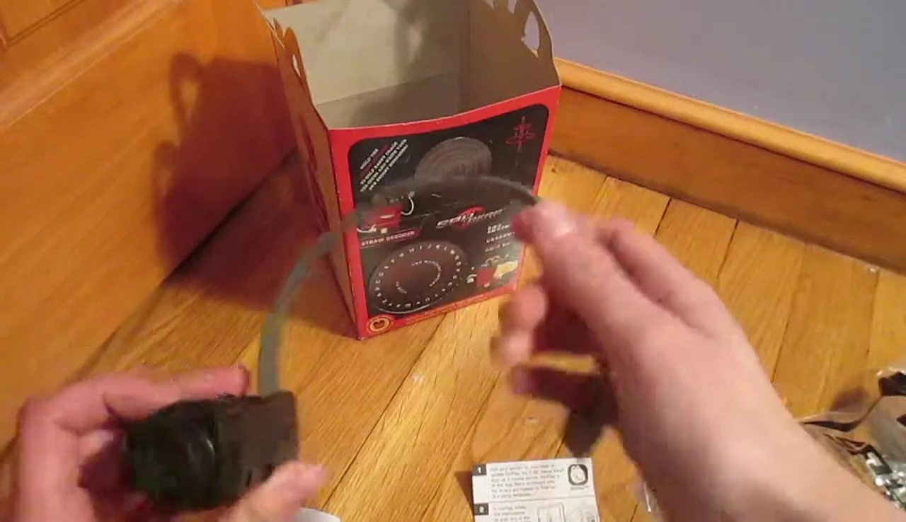 The reviewer is showing how to put the headband on.