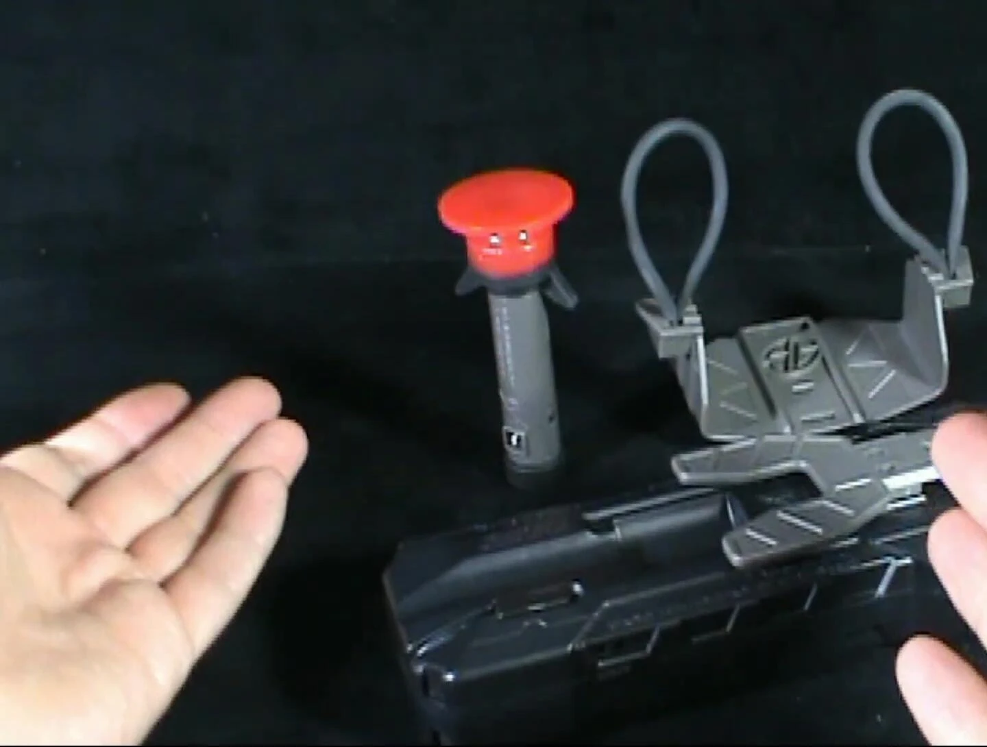 The three parts of the launcher separated.
