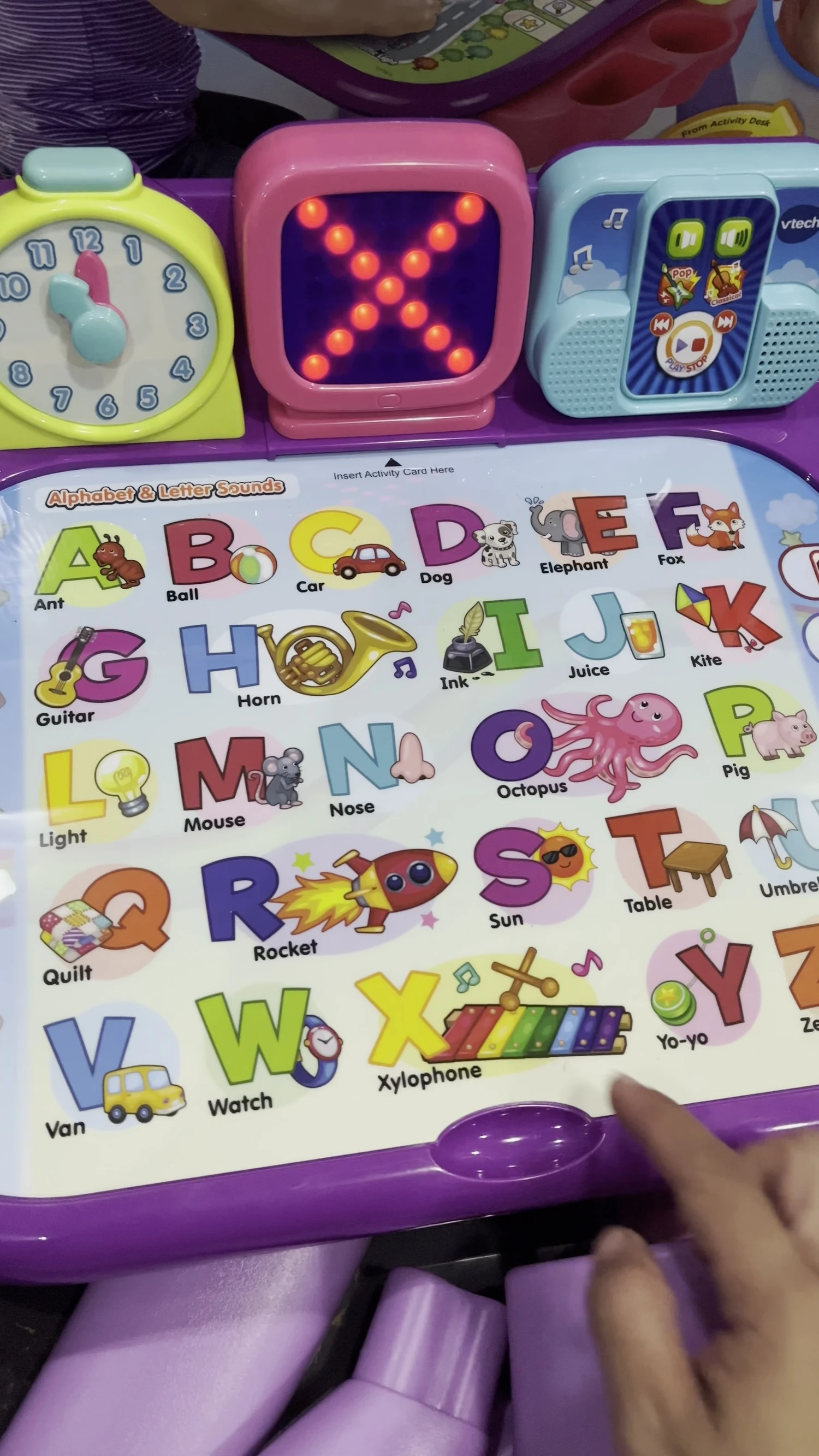 The desk showing the letters X, Y, and Z.