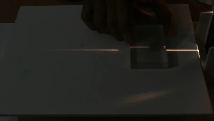 Observe how a ray passing perpendicular to the slab's surface goes straight through.