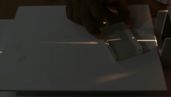 Tilt the slab or the light source to create an angle of incidence and observe the refraction of light.