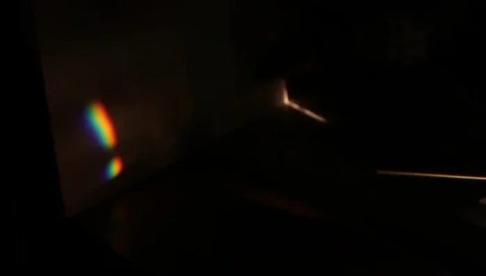Place a second prism in the path of the dispersed light to recombine the colors into white light.