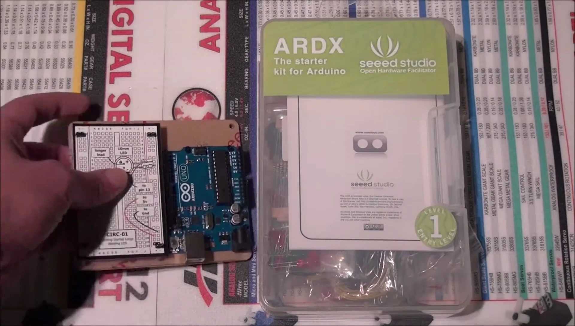Close-up of the breadboard and acrylic base included in the kit.