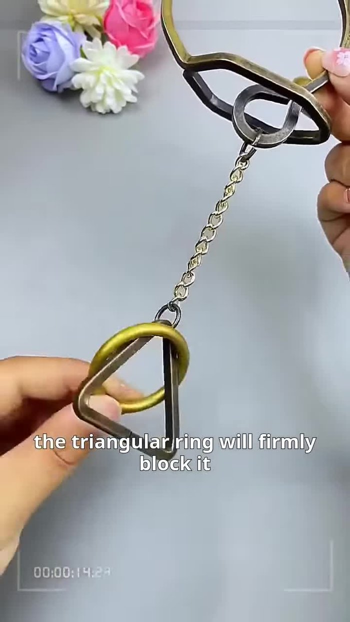 Recognize conventional approaches fail: Attempting to remove the ring downwards or upwards is unsuccessful due to the triangular ring and the round frame.