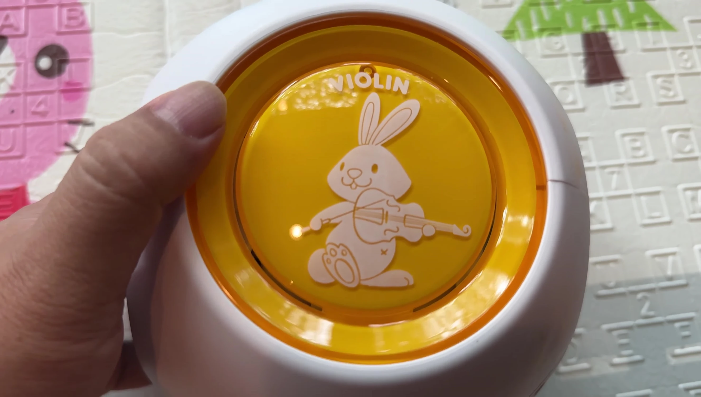 Person pressing the button on one of the sides.