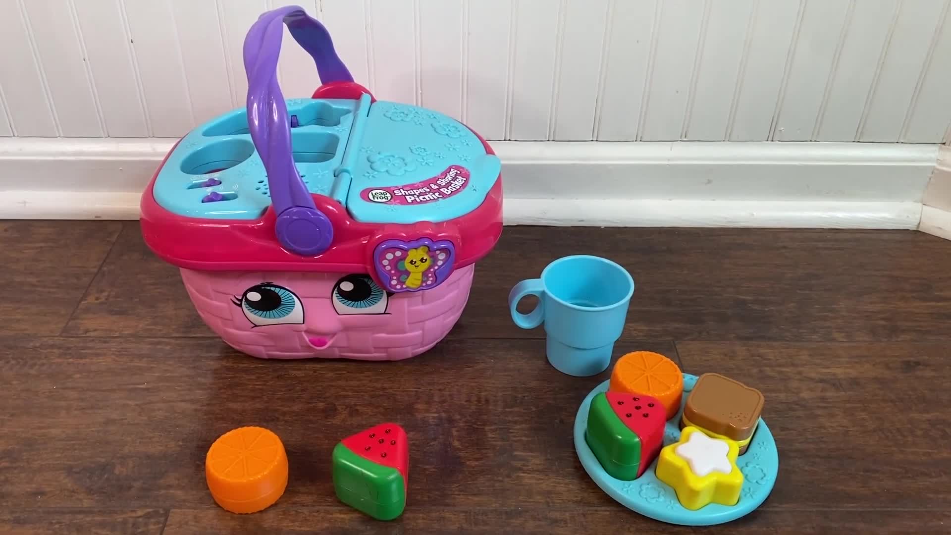 Child interacting with the shape sorter component of the toy