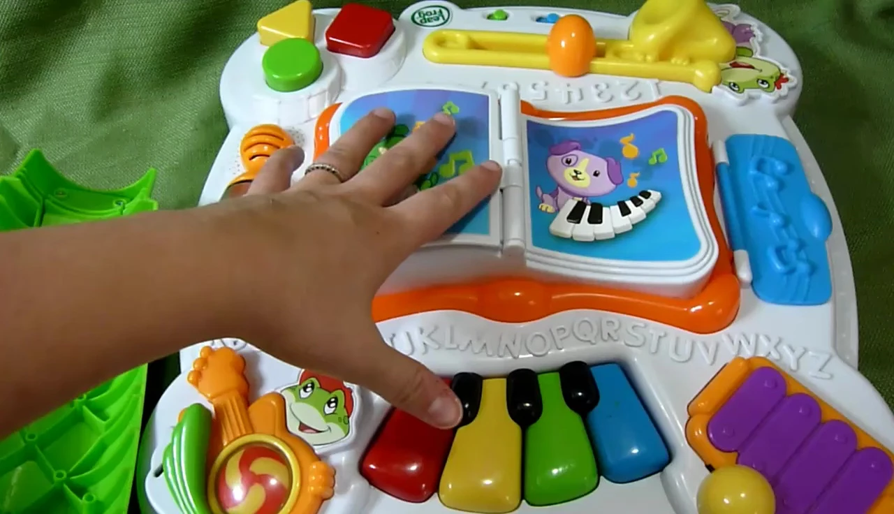 The activity table laid flat on the floor.