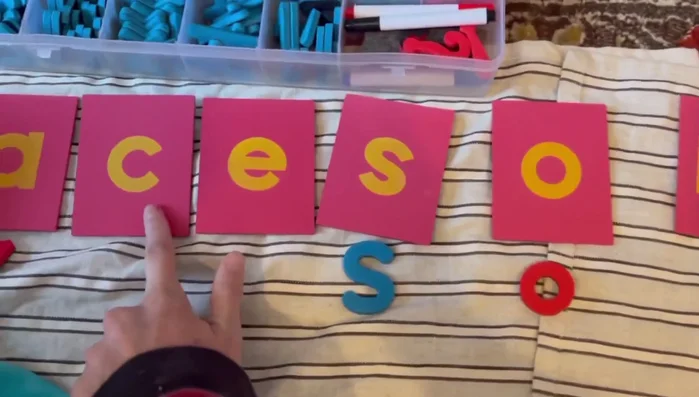 Introduce the movable alphabet to show letter placement and sounds.