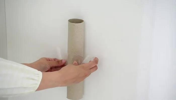 Tissue Paper Roll Activity: Stick tissue paper rolls to a wall, place a basket underneath, and let kids throw balls or Lego pieces through the tubes.
