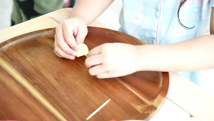 Fruit Sculpture: Use small fruit cubes, toothpicks, and let kids create patterns and structures.