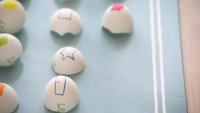 Eggshell Hammering: Prepare decorated eggshells and let kids safely hammer them.
