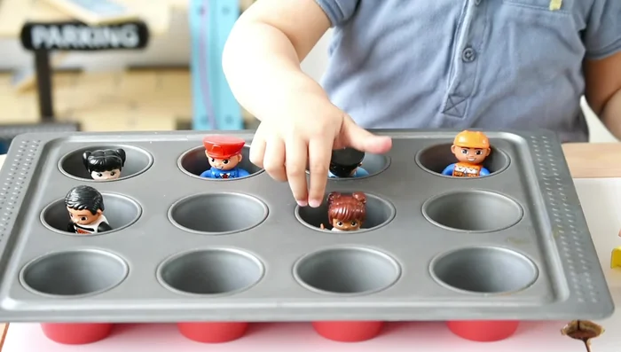Save the Trapped Animals/People: Use a cupcake tray to trap small toys, and let kids cut the tape (or peel stickers) to rescue them.