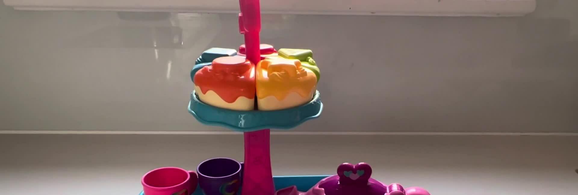Close-up of the LeapFrog Musical Rainbow Tea Party Set components in the box