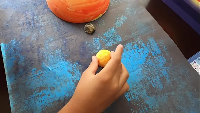 Carefully place the foam balls (planets) onto the board to create your solar system model.