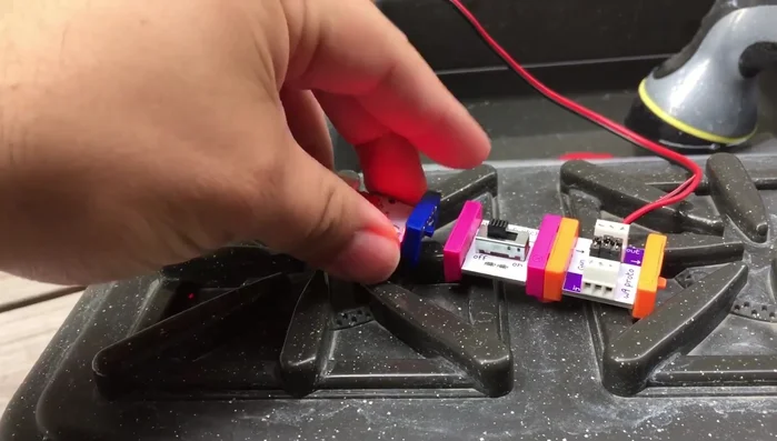 Use a slide switch to control the pump's power, enabling on/off functionality.