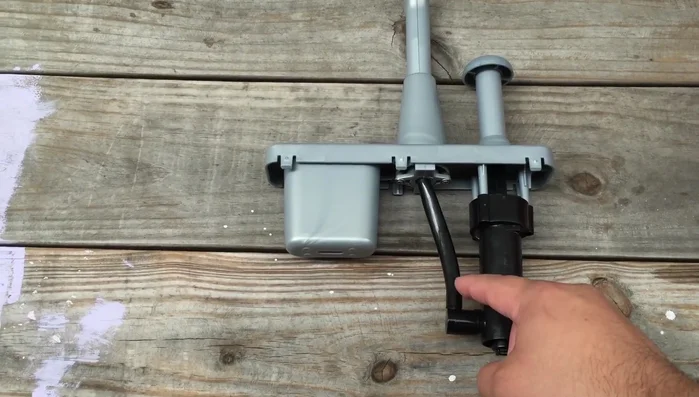 Cut the tube connecting the manual pump, as it's glued on.