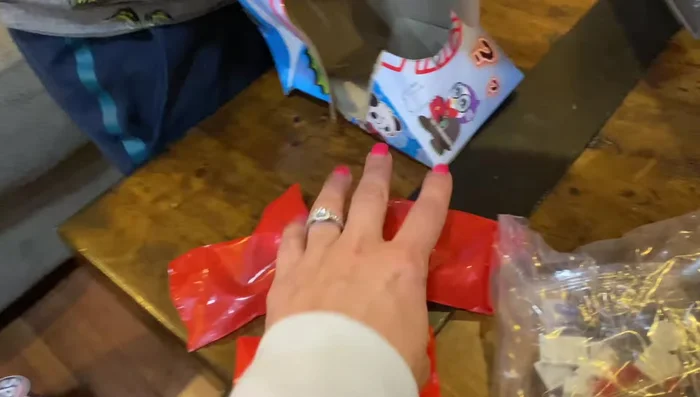 Open the mystery bags and identify the contents: figures, accessories, and additional mystery bags.