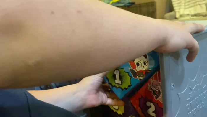 Open the mystery bags and identify the contents: figures, accessories, and additional mystery bags.