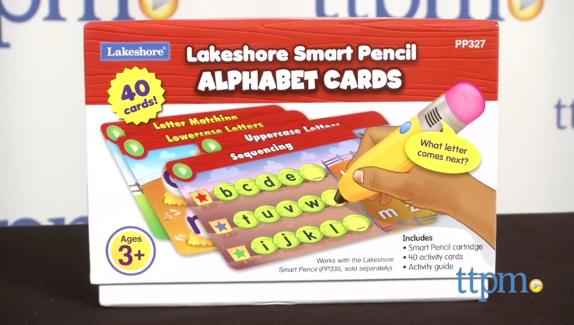 A child using the Smart Pencil with alphabet cards.