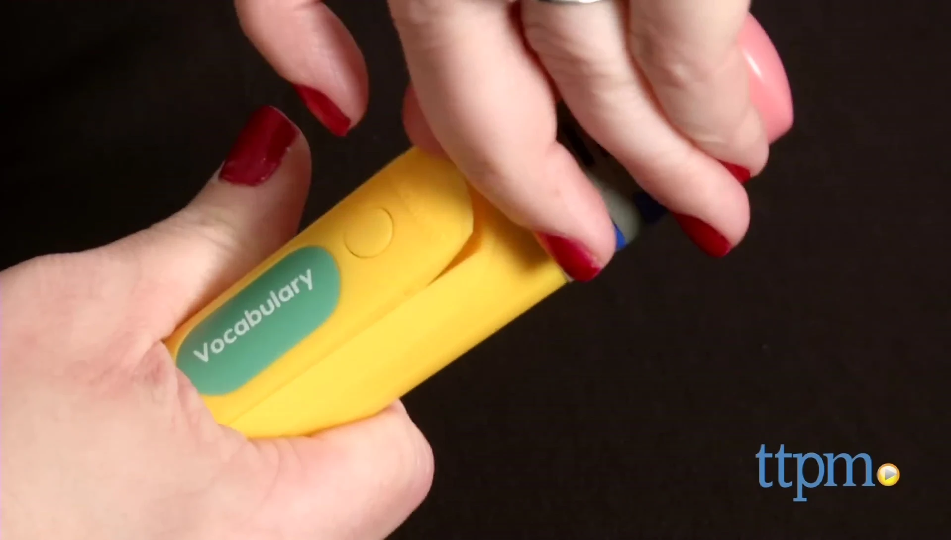 The reviewer demonstrating the difficulty of removing the audio cartridge.