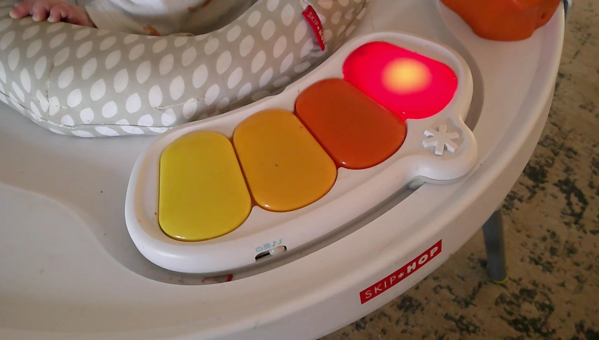 Baby playing with the light-up piano