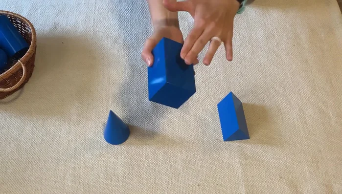 Introduce the triangular prism: explain its characteristics (two triangular bases).