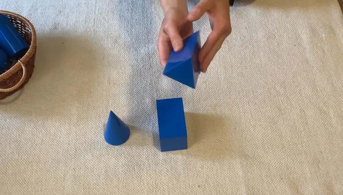 Introduce the triangular prism: explain its characteristics (two triangular bases).