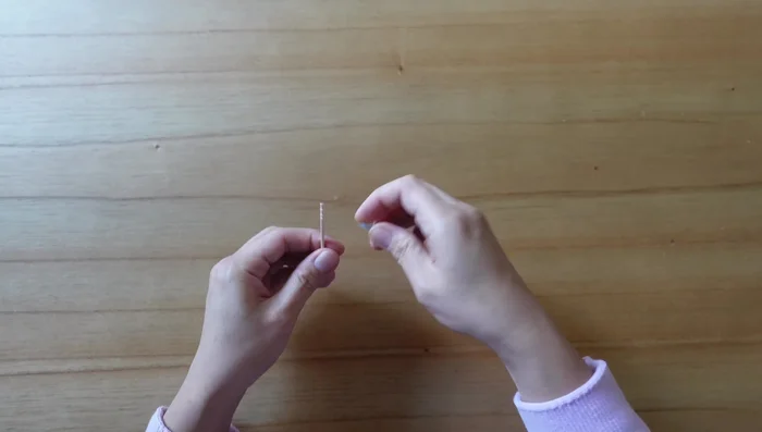 Break the other end of the toothpick once tight and secure.