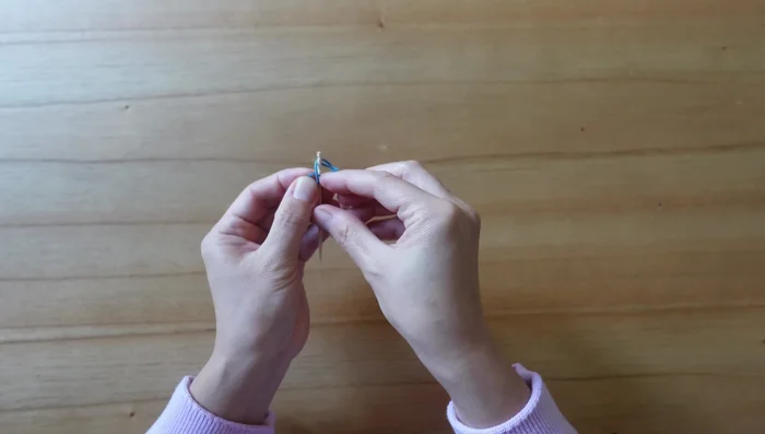 Break the other end of the toothpick once tight and secure.