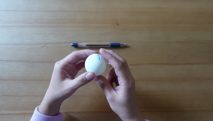 Use a pen to gently enlarge the hole to fit the toothpick.