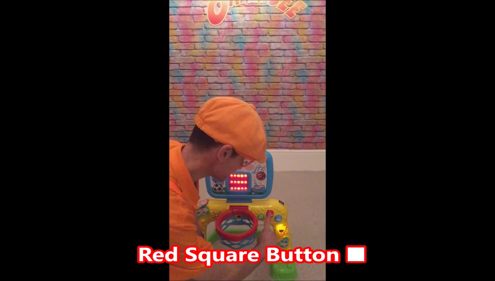 Close-up of the red square button.