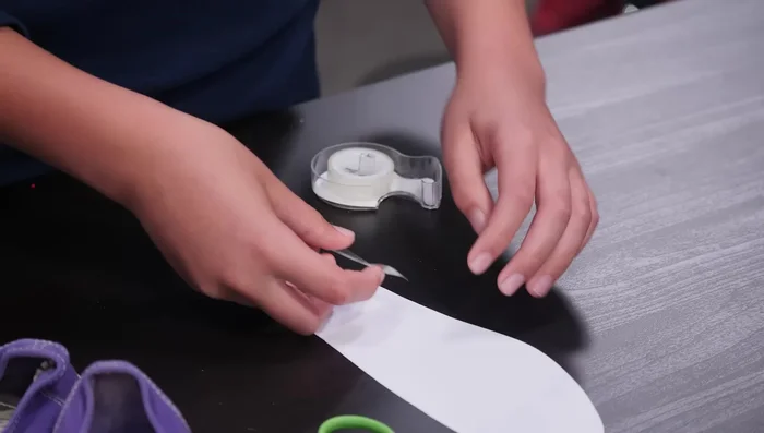 Write your secret message on the cardstock side of the sole.